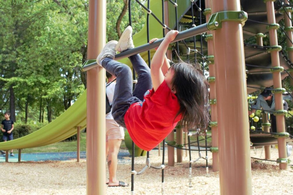 Kids have been enjoying the new climbing features at the playground. Vikki Hui photo. 