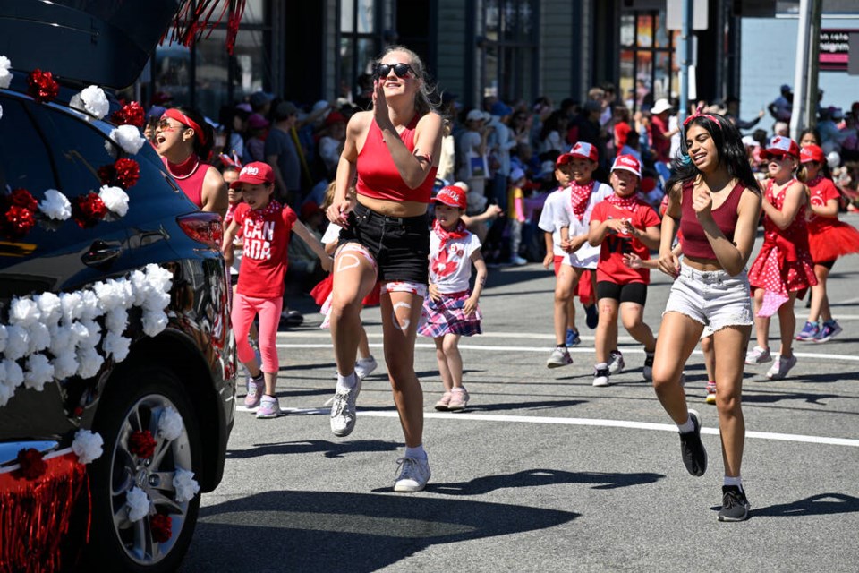 The streets around Steveston Village were lined with thousands of people wanting to get a good view of the return of the in-person Salmon Festival parade on Saturday morning. Galileo Cheng photos 