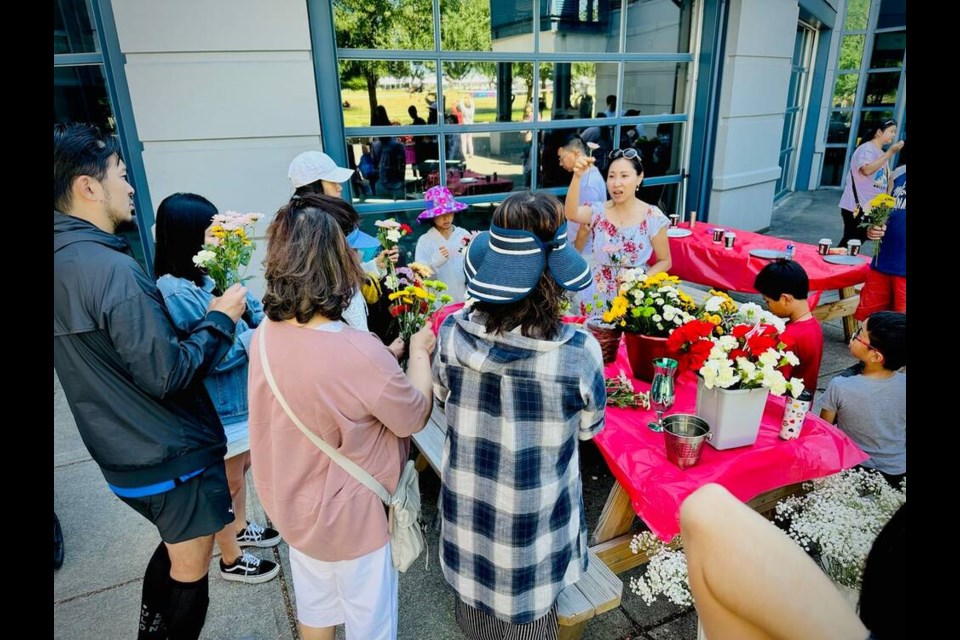 Richmond's friendly neighbourhood florist Jane Lee and fellow residents held a flower party to celebrate Canada Day weekend. Jane Lee photo 