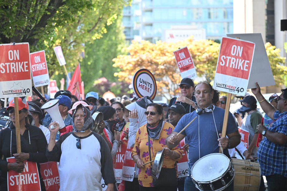 Sheraton workers and their allies gathered outside Sheraton Vancouver Airport on Minoru Boulevard on Friday to mark one month since they walked off the job. Galileo Cheng photo 