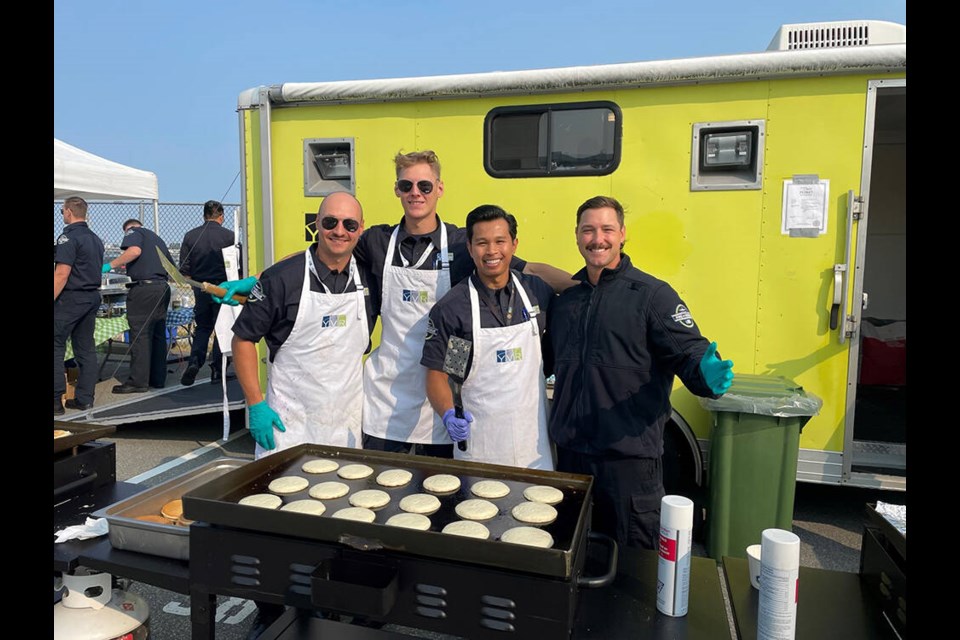 Twenty-five YVR firefighters were serving up breakfast on Thursday at Templeton Canada Line Station. 