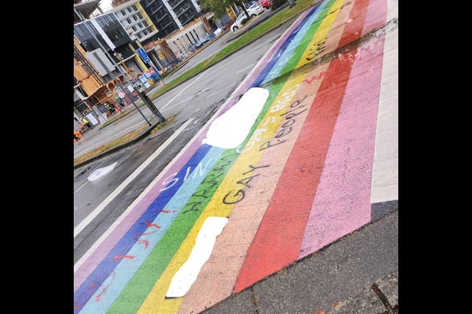 Richmond’s rainbow crosswalks on Minoru Boulevard and at Palmer secondary were hit by homophobic vandals again on Monday night. The Richmond News has hidden the more offensive language.
