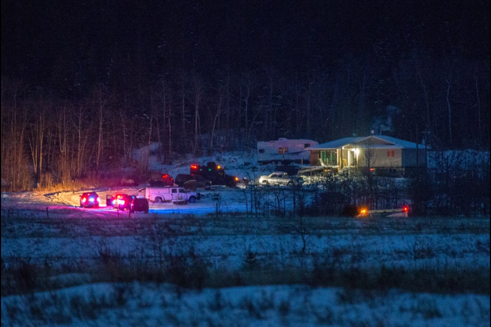 RCMP and EMS surround a house on Îyârhe Nakoda First Nation on Jan. 7, 2017, where members of the RCMP served warrants for first degree murder of Lorenzo Bearspaw, a.k.a Billy Bearspaw. John Stephens, Ralph Stephens and Deangelo Powderface were the suspects sought in the arrest warrant.

RMO FILE PHOTO