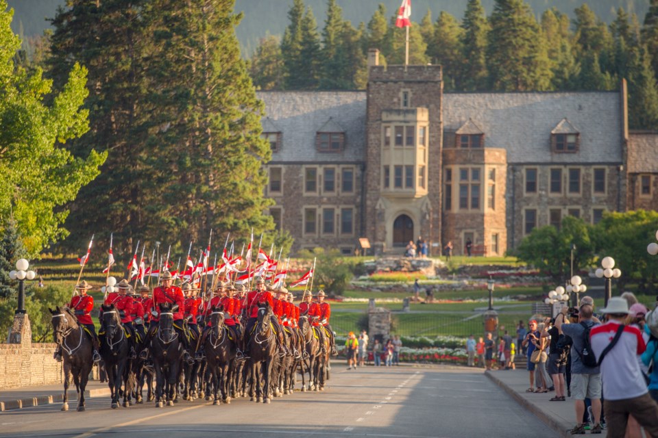 The RCMP Musical Ride parades across the Bow River Bridge in Banff in 2017. RMO FILE PHOTO