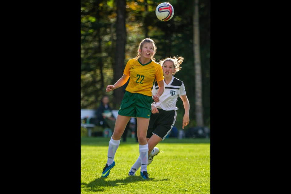 Canmore Wolverines Sophia Wilson heads the ball forwards during a game against Holy Trinity Academy at Millennium Park on Tuesday, September 24, 2019. Evan Buhler RMO PHOTO