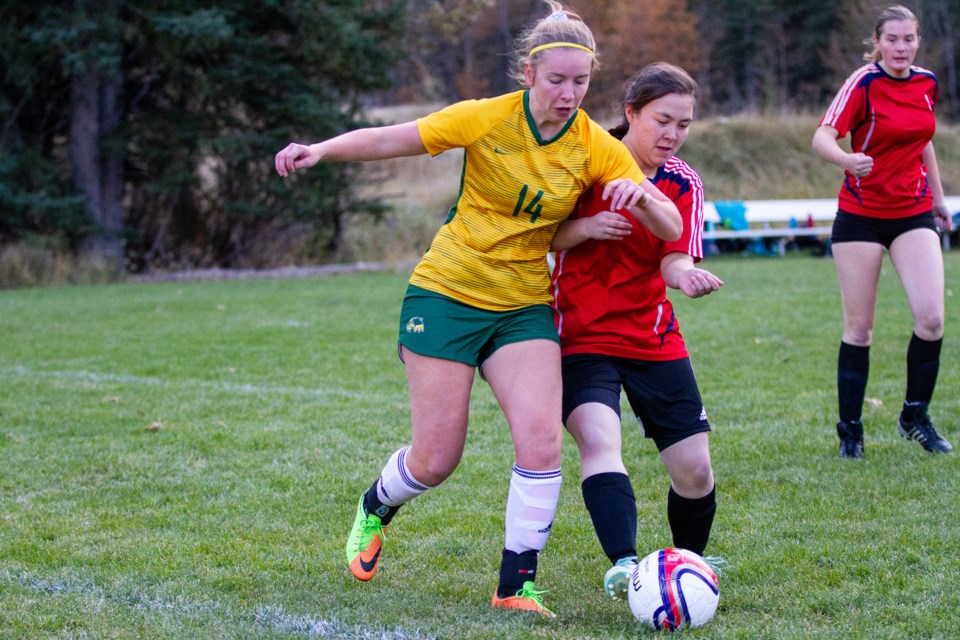 Canmore Wolverines Jaiden Webster dribbles past a Strathmore Spartans defender in a game at Millennium Park on on Tuesday (Oct. 15). The Wolverines won the game 8-0 finishing third place in league play. Evan Buhler RMO PHOTO