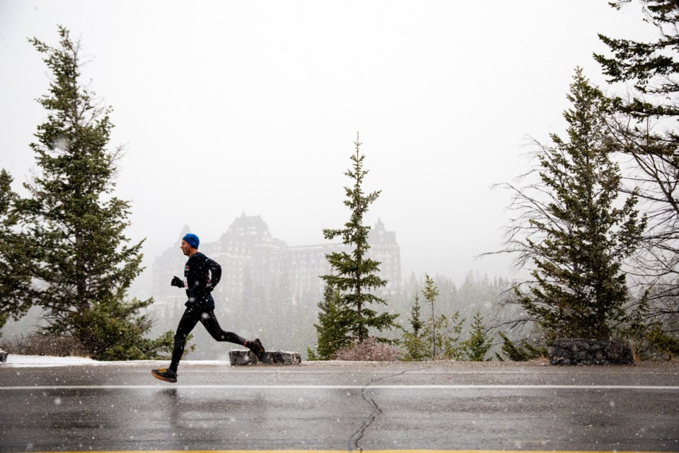A participant runs past a view of the Fairmont Banff Springs Hotel from surprise corner during the first leg of the Banff Ekiden Relay race on Saturday (Oct. 19). Evan Buhler RMO PHOTO