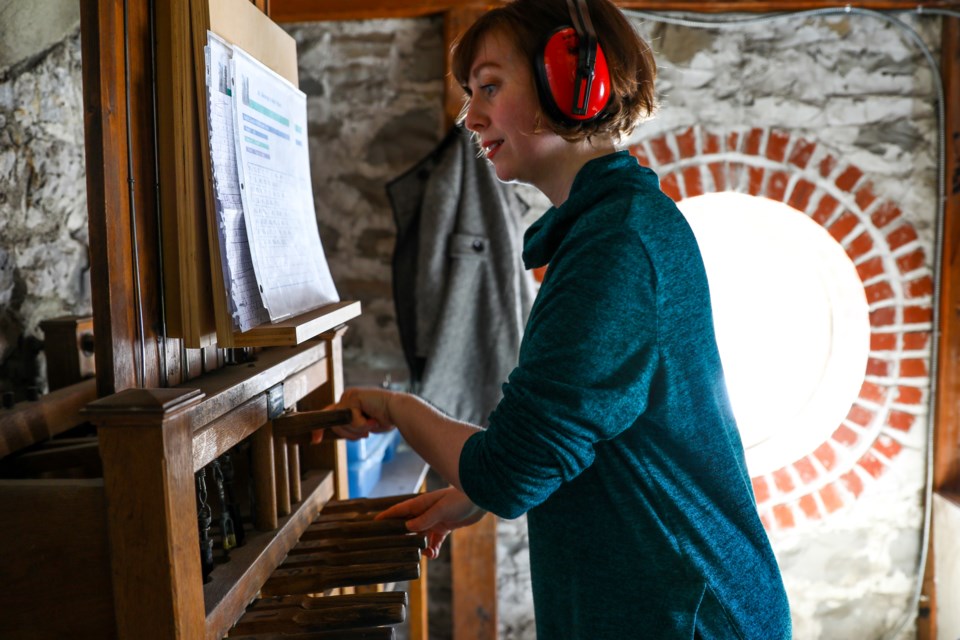 Heather Jean Jordan, a music teacher in Banff, plays the bells at St. George's-in-the-Pines as a way to lift peoples’ spirits as the novel coronavirus COVID-19 spread, on March 21, 2020. EVAN BUHLER RMO PHOTO