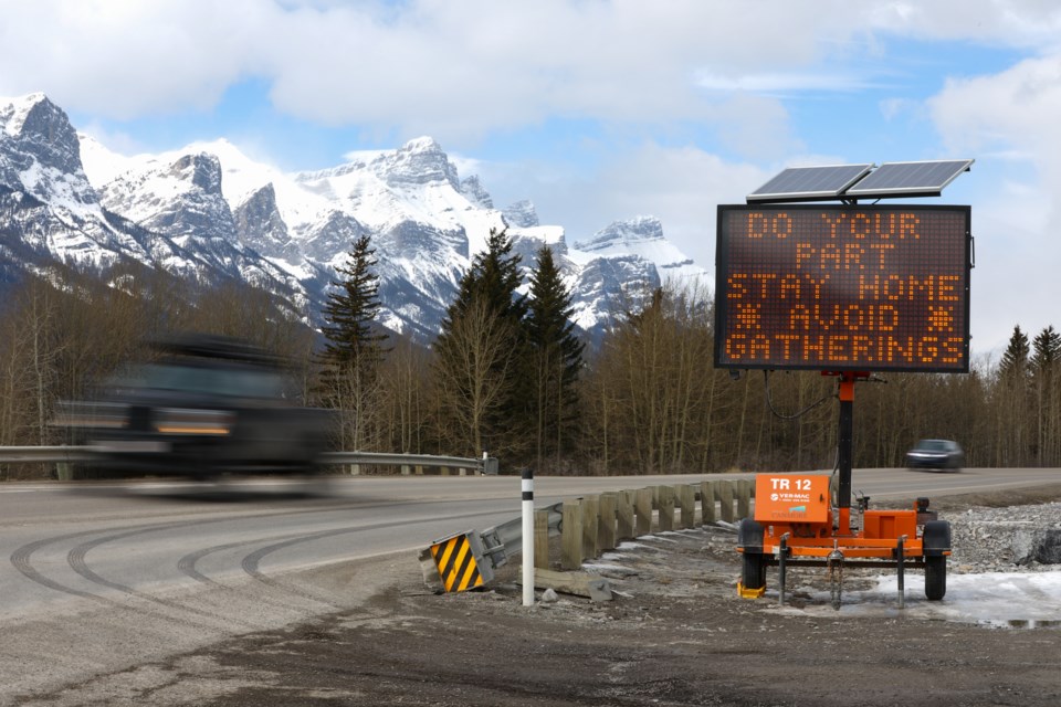 A sign along Highway 1A near the entrance to Canmore notifies drivers to stay home to help stop the speed of COVID-19 on Thursday (March 26). EVAN BUHLER RMO PHOTO⁠