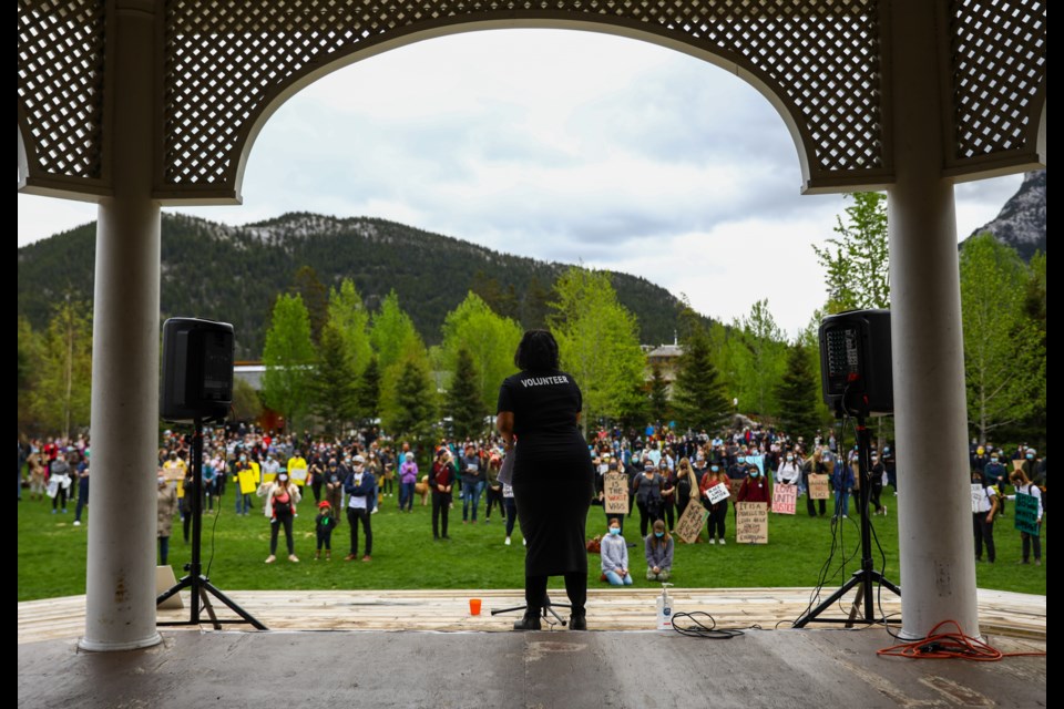 Allison Yearwood speaks to the large crowd at the Banff Supports BLM Vigil in Central Park on Saturday (June 6). More than 600 supporters marched down Banff Avenue in support and solidarity with local Black, Indigenous, and People of Colour (BIPOC) community. Anti-racism protests have swept across the globe in response to the disproportionate number of killings of black citizens by police officers in the U.S. EVAN BUHLER RMO PHOTO⁠