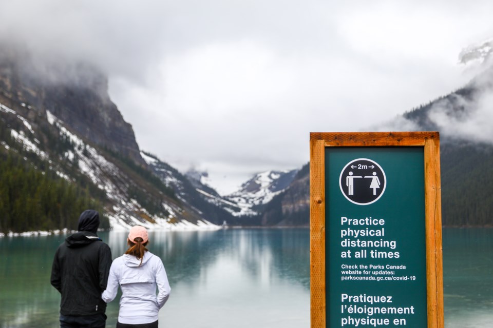 Tourists walk along the shore of Lake Louise on Saturday (June 6). EVAN BUHLER RMO PHOTO⁠