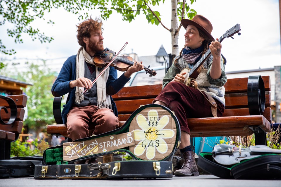 Alex Jones and Wiley Snoot of the Salty Lemon Stringband busk along Banff Avenue. RMO FILE PHOTO