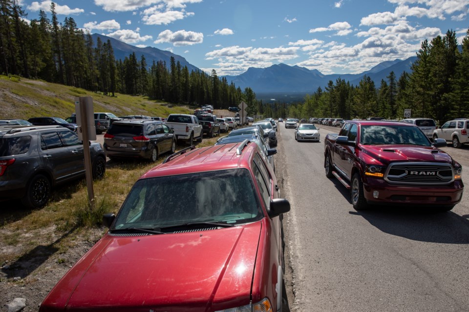 Motorists search for parking places at the Grassi Lakes overflow parkinglot  on Saturday (July 18). Thousands of tourists flocked to provincial parks to celebrate Alberta Parks Day. EVAN BUHLER RMO PHOTO⁠