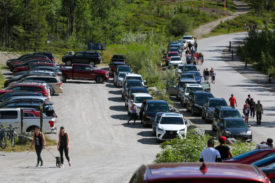 Motorists search for parking places at the Grassi Lakes trailhead on Saturday (July 18). Thousands of tourists flocked to provincial parks to celebrate Alberta Parks Day. EVAN BUHLER RMO PHOTO⁠