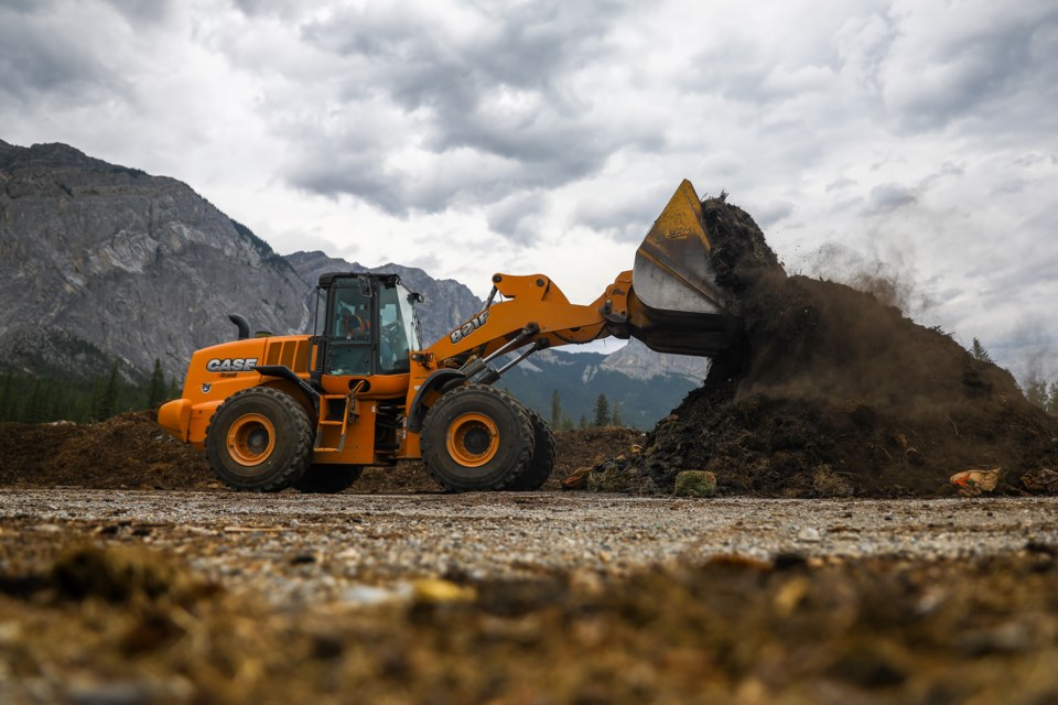 Clinton Whelan operates a front loader to turn a pile of compost at the Francis Cooke Class III Landfill and Resource Recovery Centre on Thursday (Aug. 6). EVAN BUHLER RMO PHOTOâ 