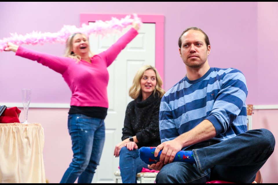 Shannon Andrew, left, Chezlene Kocian and Brian McDonald rehearse a scene from the upcoming Pine Tree Players production of Five Women Wearing the Same Dress on Sunday (Nov. 1). The play will run from Nov. 18-28 at Canmore Miners' Union Hall and stream online. EVAN BUHLER RMO PHOTO