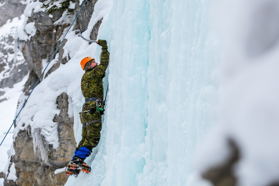 Trooper Ryan Bridge of the Canadian Armed Forces from 41 Canadian Brigade Group ice climbs at King Creek in Kananaskis on Tuesday (Feb. 16). The week-long training focused on ice climbing, snowshoeing, and backcountry skiing under the guidance of Yamnuska Mountain Adventures. EVAN BUHLER RMO PHOTO