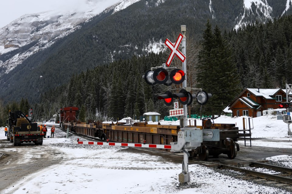 Three empty train cars that derailed are hooked up and moved out of the way in Field, B.C. on Saturday (March 20). EVAN BUHLER RMO PHOTO