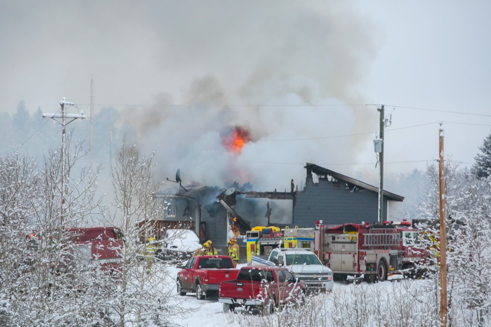 Nakoda Fire Department and Exshaw Fire Rescue crews attend the scene of a structure fire on the Stoney Nakoda First Nation, about four kilometres southwest of the Morley townsite on Thursday (March 25). EVAN BUHLER RMO PHOTO