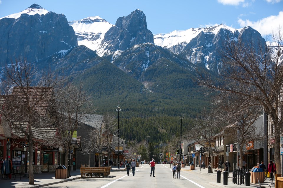 Pedestrians walk along the middle of Main Street after it was closed to vehicle traffic on Wednesday (May 5). The aim of the closure is to provide more space for pedestrians to practice physical distancing, and to provide local businesses with more space for customers. EVAN BUHLER RMO PHOTO