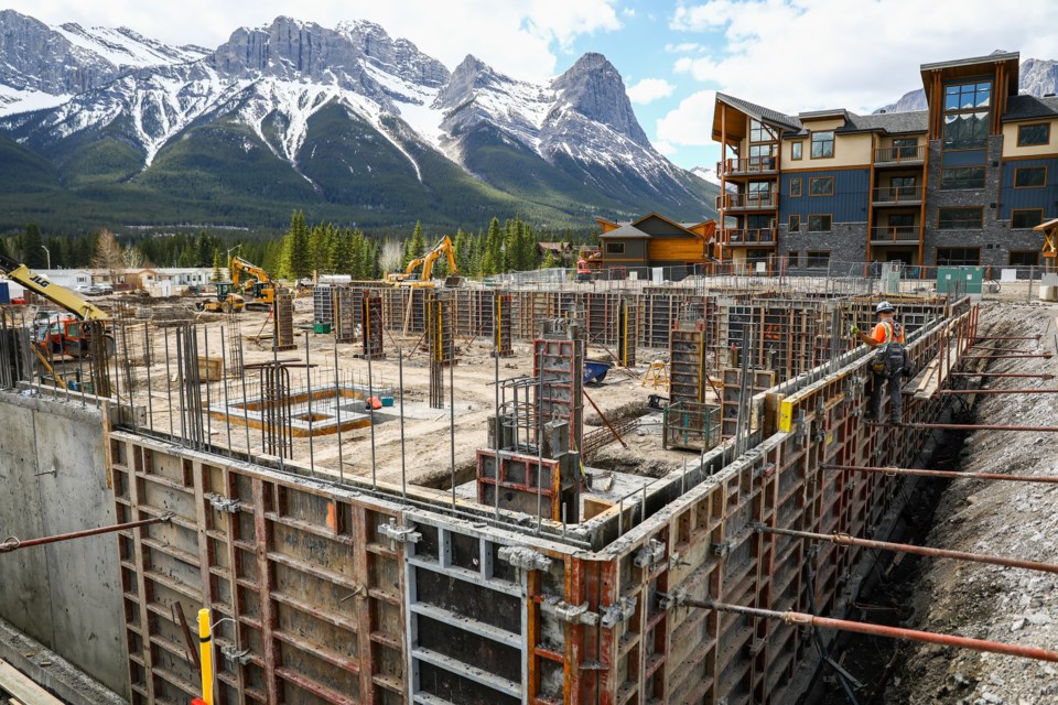 A construction worker works on the foundation for the Jack Pine Lodge building in Spring Creek on Friday (May 14). EVAN BUHLER RMO PHOTO