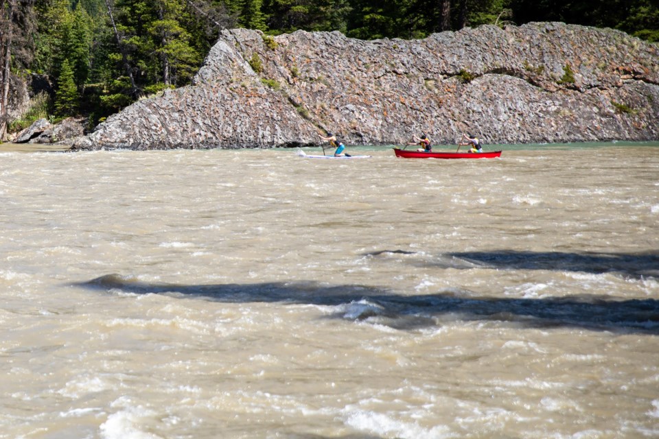 A group of paddlers launch into a raging Bow River downstream of Bow Falls on Friday (June 4). EVAN BUHLER RMO PHOTO