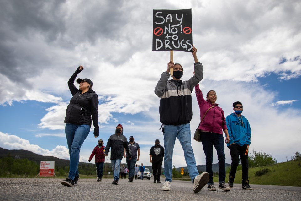 Summer Twoyoungmen, left, Baston Labelle,  Darvette Lefthand and Mitchel Lefthand lead the march during the Battle Against Drugs Walk, a solidarity protest by those fed up with the deadly and adverse toll illegal drugs have taken on the reserve on Saturday (June 5). The walk was organized by the WÃ¡cÃ¡gÃ¢ Ã´kÃ³nÃ¡âgÃ®cÃ­yÃ¢âbÃ® group, meaning a shield that provides protection physically and spiritually in the Stoney language. EVAN BUHLER RMO PHOTO