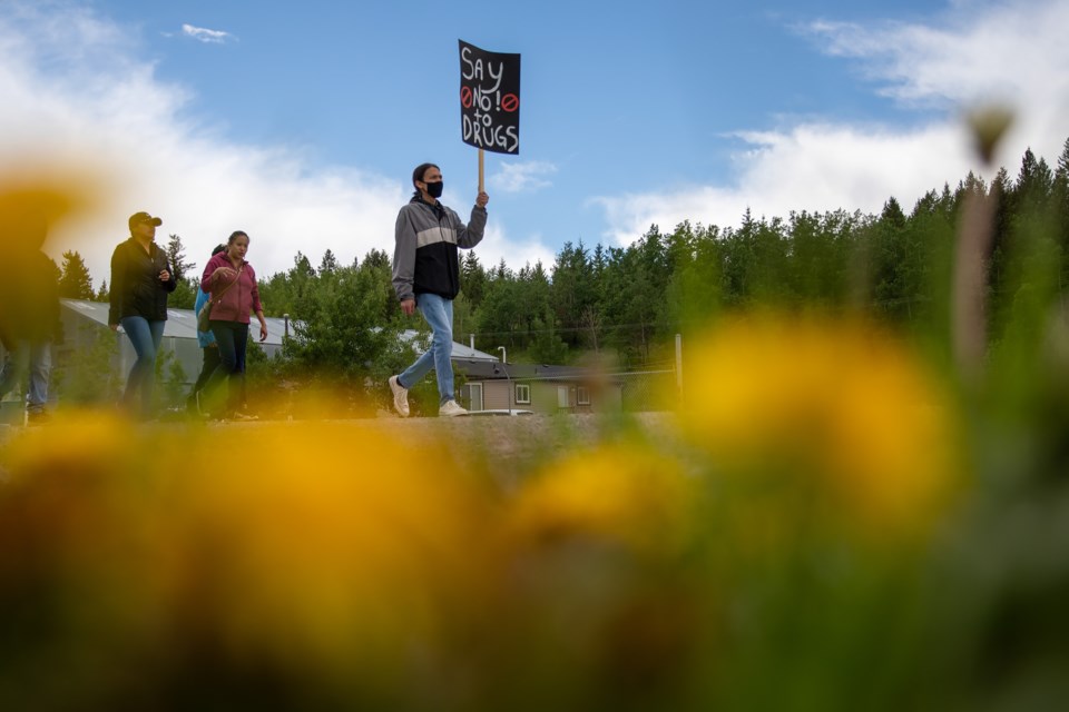 Summer Twoyoungmen, left, Baston Labelle,  Darvette Lefthand and Mitchel Lefthand lead the march during the Battle Against Drugs Walk, a solidarity protest in June 2021 by those fed up with the deadly and adverse toll illegal drugs have taken on the reserve. The walk was organized by the Wácágâ ôkóná’gîcíyâ’bî group, meaning a shield that provides protection physically and spiritually in the Stoney language. 

RMO FILE PHOTO