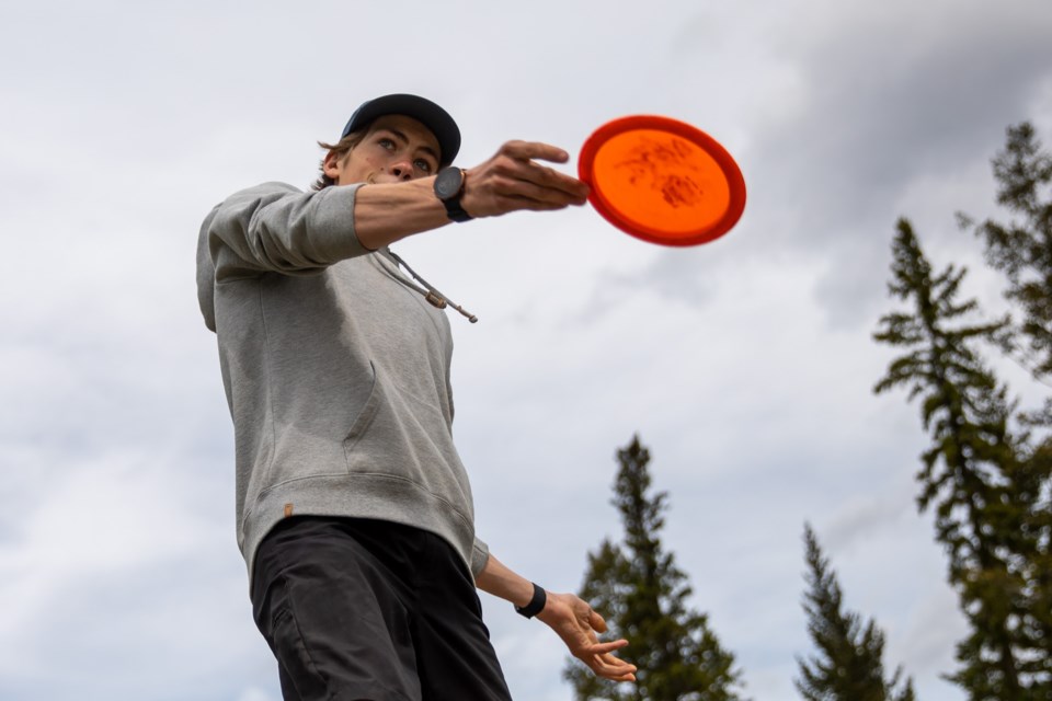 Benjamin Brousseau plays his tee shot on the fourth hole during a round of disc golf with friends at the Three Sisters Disc Golf course on Friday (June 11). EVAN BUHLER RMO PHOTO
