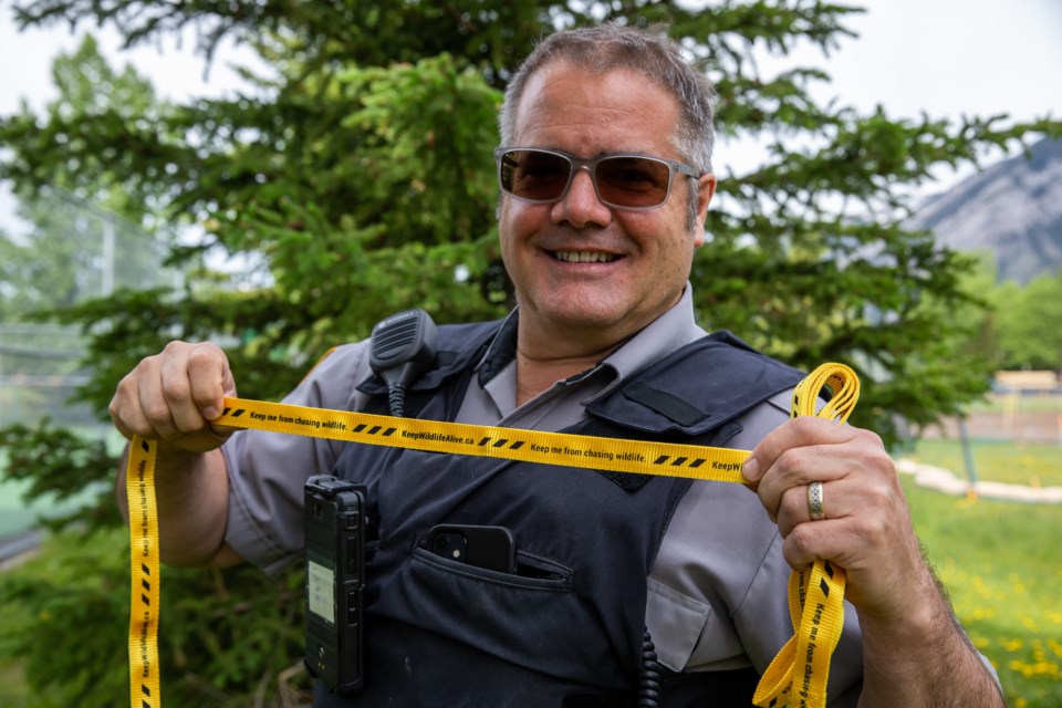 Tony Clark, Town of Banff manager of municipal enforcement, holds up a leash that bylaw officers will hand out to dog owners. Bylaw will hand out leashes to dog owners with an on leash dog as a positive re-enforcement, and in some circumstances, will hand out the leashes to dog owners instead of a $100 fine. EVAN BUHLER RMO PHOTO