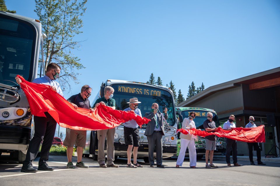 Representatives cut the ribbon at the opening of Roam Transit Operations and Training Centre in Banff on Tuesday (June 29). The new facility is a net zero carbon emissions building and heated by biomass energy district heating system. Roam Transit also unveiled three new battery electric buses. EVAN BUHLER RMO PHOTO