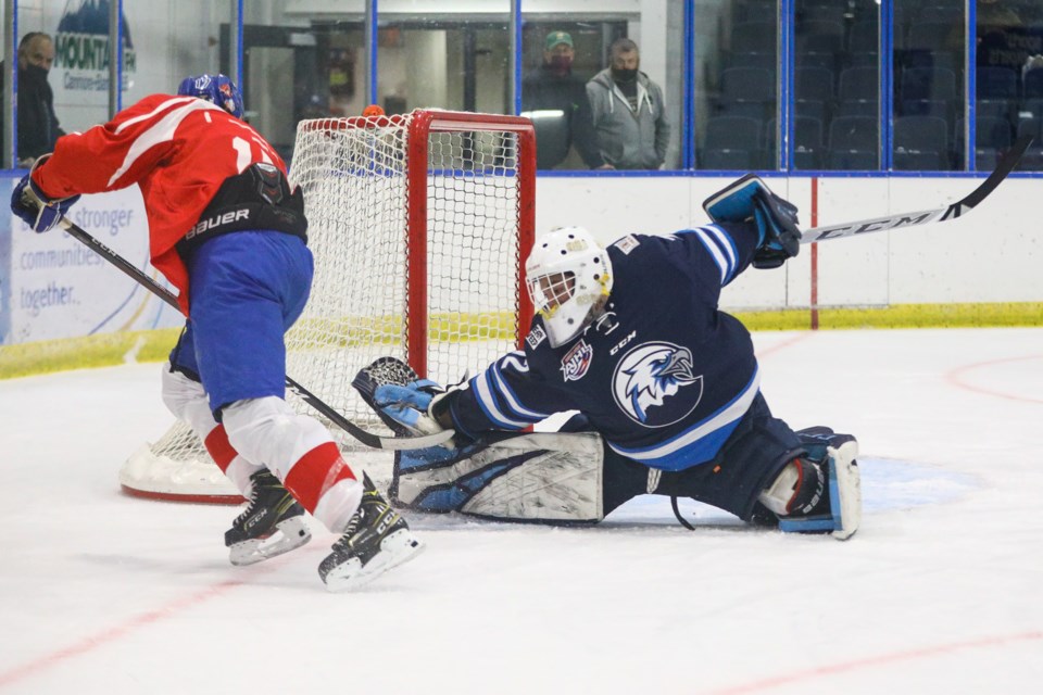 Canmore Eagles goaltender Andreai Proctor-Ramirez makes a save off of a Whitecourt Wolverines forward during an exhibition game at the Canmore Recreation Centre in Sept. 2021. RMO FILE PHOTO
