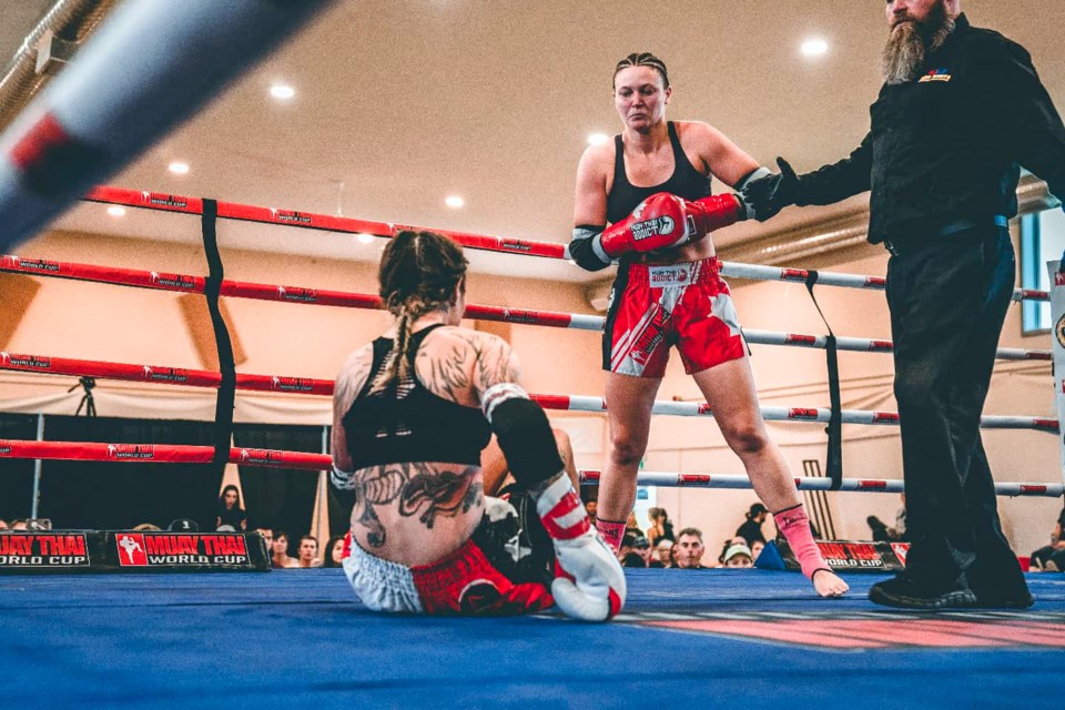 Banff's Maddie MacPherson, centre, defeated Saskatchewan’s Charlene Clarke by technical knockout in her Canadian debut at the Muay Thai World Cup’s Prospect Series at Bullhead Community Hall in Tsuut’ina First Nation near Calgary on Saturday (Sept. 4). SUBMITTED PHOTO