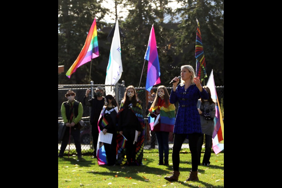 Local musician Aurora Borin speaks to about 100 people who took part in the Banff Pride walk on Monday (Oct. 4). The group walked from the pedestrian bridge to Banff Community High School for the raising of the Pride flag.

GREG COLGAN RMO PHOTO