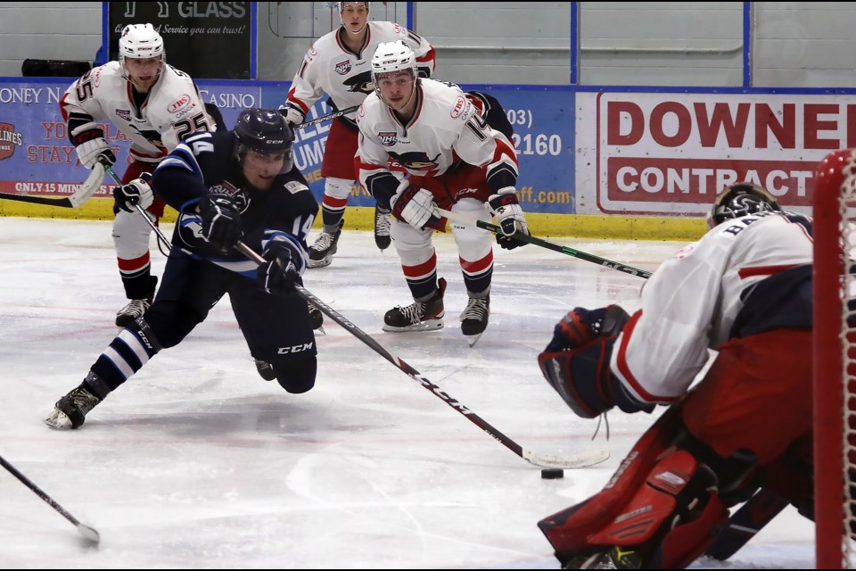 Canmore Eagles Carter Myrol, left, gets some space to get a shot chance on Brooks Bandits goalie Ethan Barwick on Thursday Oct. 14, 2021 at the Canmore recreation centre. The Canmore Eagles lost 5-0.

GREG COLGAN RMO PHOTO