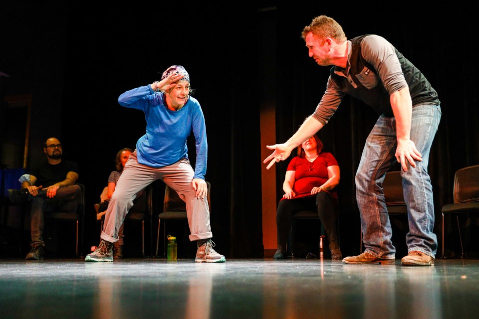 Renee Lazor, left, and Colton Darnell act out a scene during Musical Chairs, a live performance by Mountain Improv Alliance at artsPlace on Thursday (Nov. 25). EVAN BUHLER RMO PHOTO