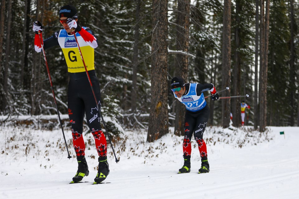 Brian McKeever of Canada follows his guide Graham Nishikawa during the men's short classic visually impaired race in the 2021 World Para Nordic Skiing World Cup at the Canmore Nordic Centre Saturday (Dec. 4). EVAN BUHLER RMO PHOTO