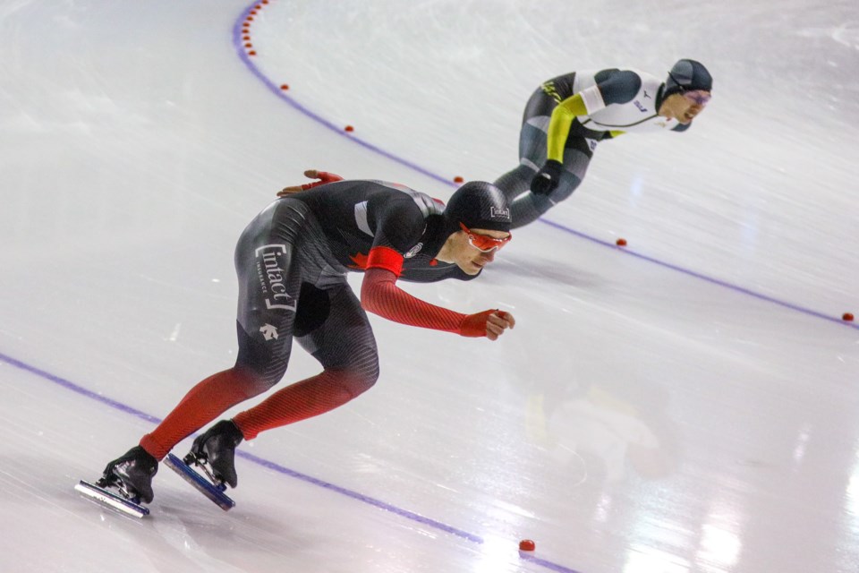 Connor Howe, left, of Canada races against  Seitaro Ichinohe of Japan in the men's 1,500m race at the ISU speed skating world cup in Calgary on Saturday (Dec. 11). EVAN BUHLER RMO PHOTO