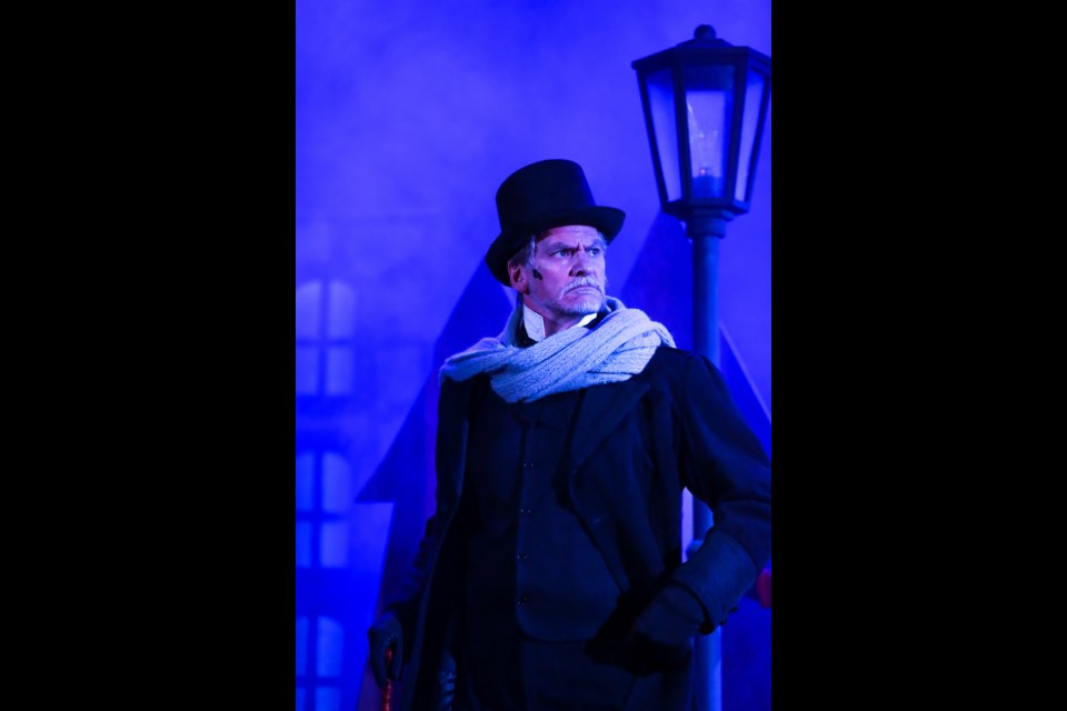 Actor Paul Cowling as Ebenezer Scrooge performs a scene during A Christmas Carol, a play by Carter-Ryan Theatre Productions presented at the Fairmont Banff Springs Hotel on Tuesday (Dec. 14). EVAN BUHLER RMO PHOTO