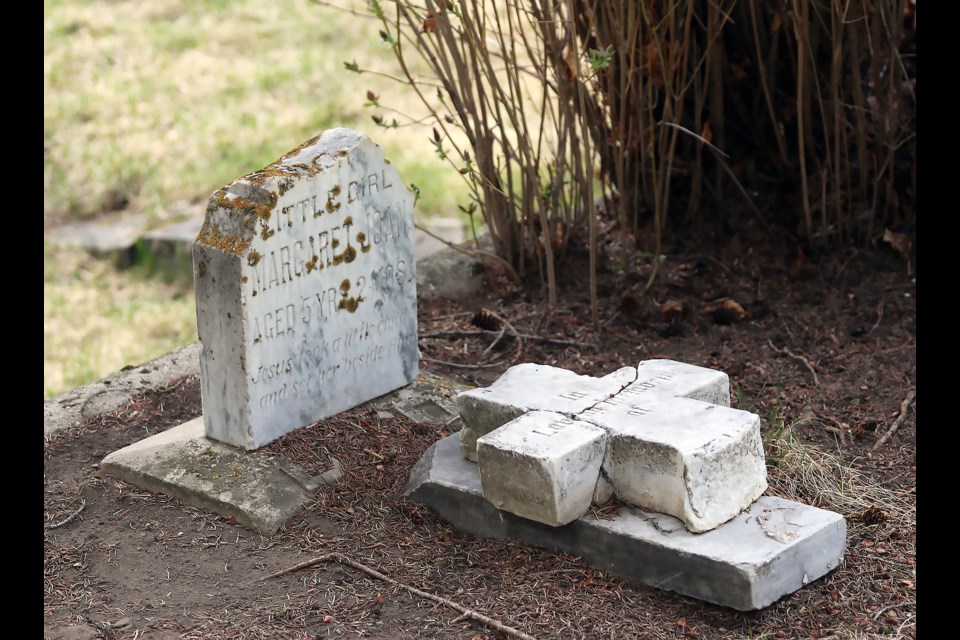 A gravestone show damage at the Old Banff Cemetery. Banff residents are organizing a clean-up of gravestones on June 11 and 12 to help restore and preserve aging headstones.

GREG COLGAN RMO PHOTO