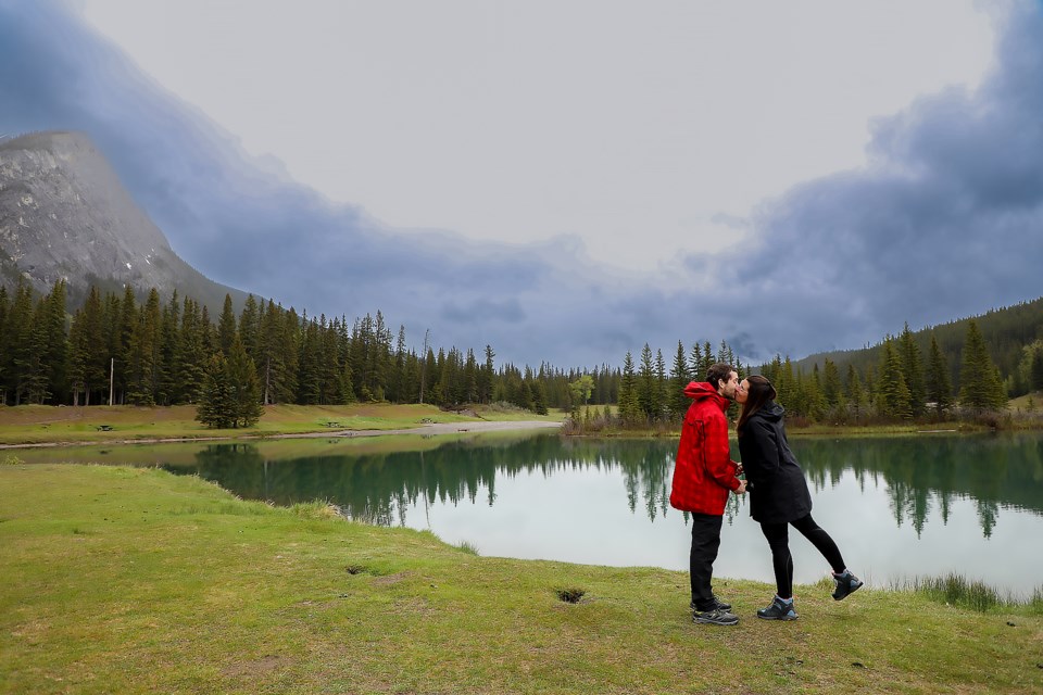 Bruno Binora, left, and Romina Simari, a couple from Argentina, kiss at Cascade ponds in Banff on Tuesday (June 7). JUNGMIN HAM RMO PHOTO