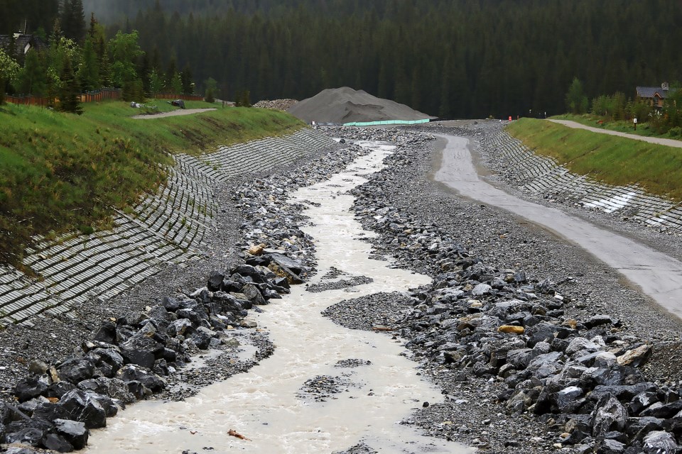 Water makes its way down Cougar Creek on Monday (June 13) with Environment Canada estimating 75-125 millimetres of rain coming down in the Bow Valley until Wednesday (June 15).

GREG COLGAN RMO PHOTO