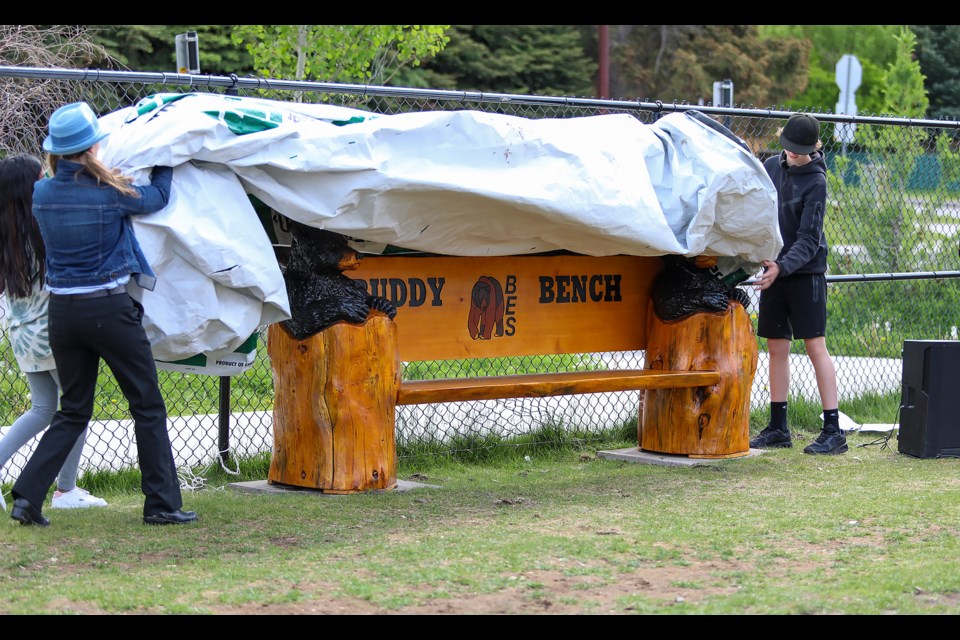 Elissa Sunderland, left, and students unveil the buddy bench mental health project at Banff Elementary School on Tuesday (June 21). JUNGMIN HAM RMO PHOTO 