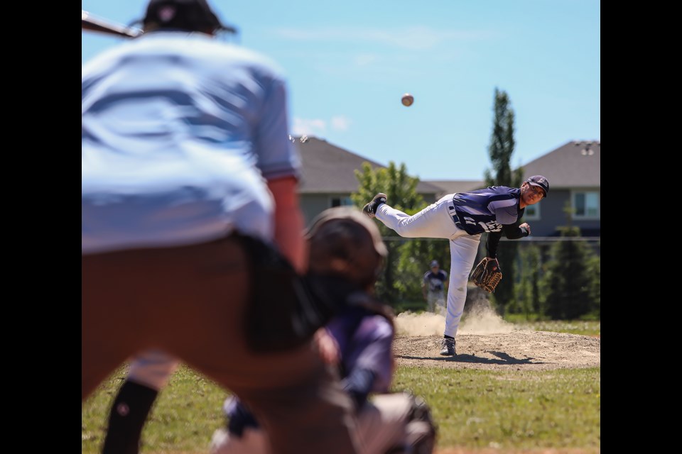 Bow Valley Blues Matt Arsenault throws a pitch against Calgary North at New Brighton Athletic Park in Calgary on Sunday (June 26). JUNGMIN HAM RMO PHOTO