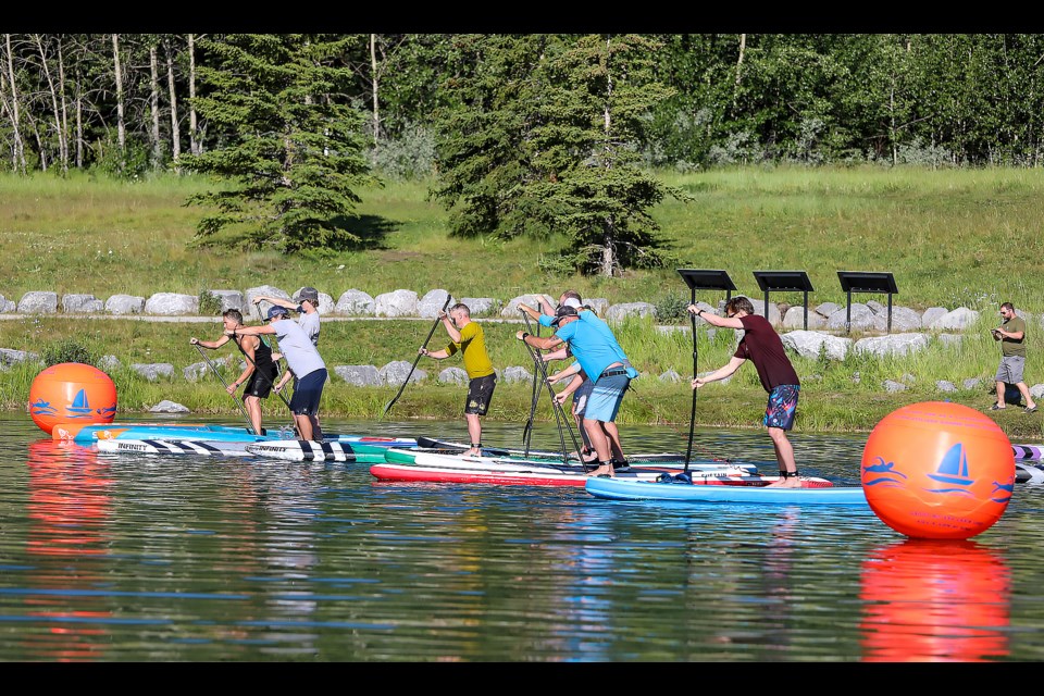 Male competitors race in the Grizzly SUP 2,000-metre event at Quarry Lake in Canmore on Saturday (July 16). JUNGMIN HAM RMO PHOTO