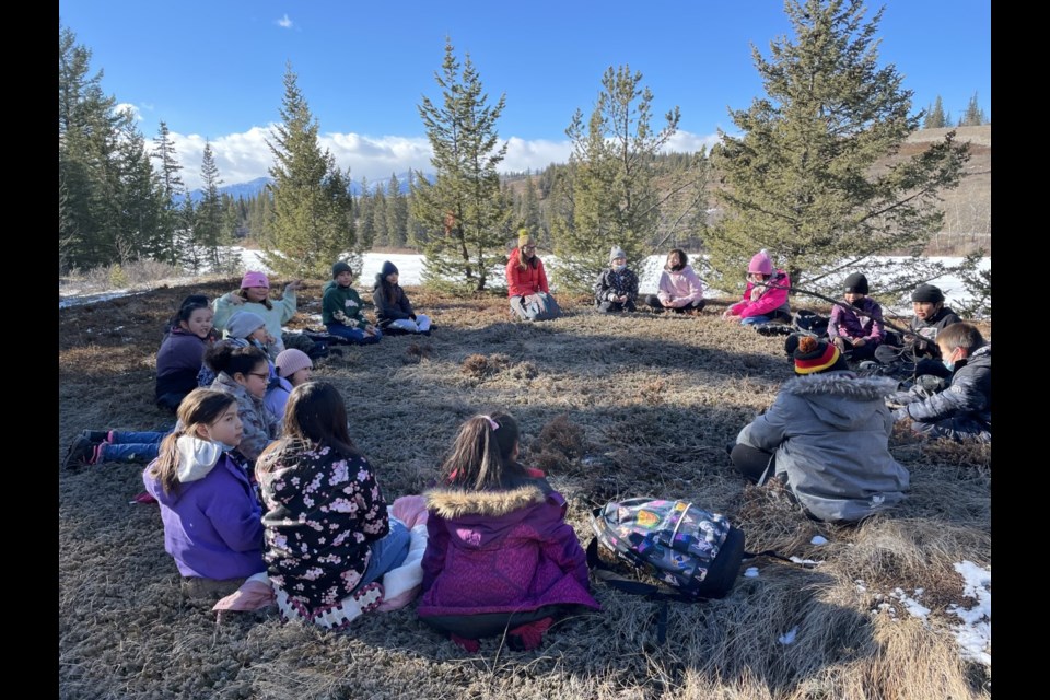 One of Nakoda Elementary School's 2021-22 Grade 4 classes meets in their outdoor classroom as part of the NES Wild program. This year, the program is expanding across all grade levels in Stoney Education Authority schools. PHOTO SUPPLIED