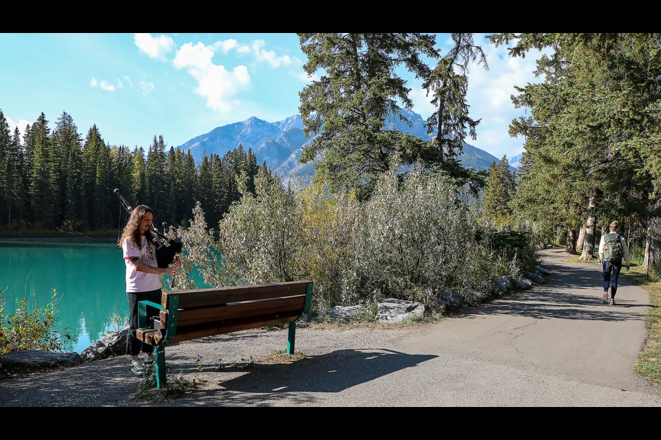 Layton Jacobson, a native of Saskatchewan, who has lived in Banff for three months, plays the bagpipes along the Bow River Trail in Banff on Thursday (Oct. 6). JUNGMIN HAM RMO PHOTO