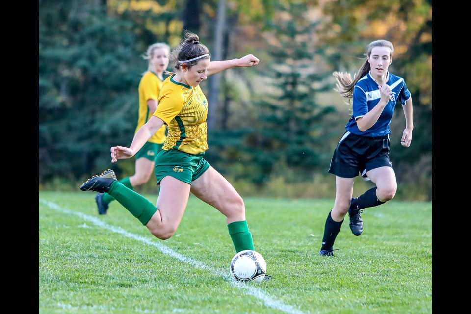 Sarah Feherty (No. 13) of the Canmore Collegiate girls soccer team attempts a shot on goal in a game against Strathmore at Millennium Park in Canmore on Thursday (Oct. 6). The Canmore Collegiate girls soccer team defeated Strathmore 6-0. JUNGMIN HAM RMO PHOTO