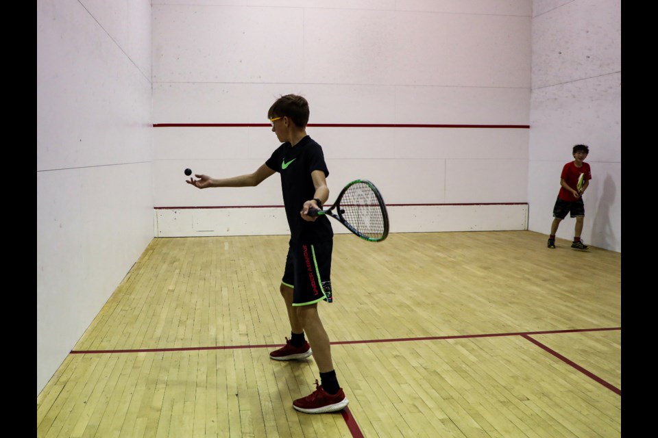Thirteen-year-old Jackson Froese, left, and 10-year-old Cameron Duncan play squash for the first time at a  'try-it' program hosted by the Bow Valley Squash Foundation on the squash courts at the Banff Rocky Mountain Resort in Banff on Thursday (Oct. 6). JUNGMIN HAM RMO PHOTO
