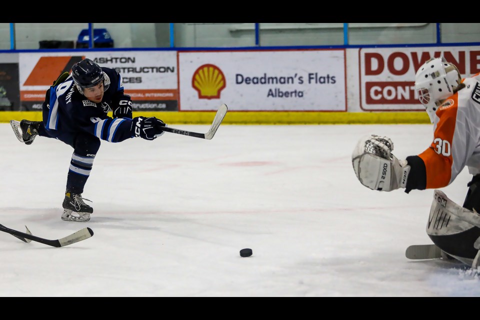 Canmore Eagles Rhett Dekowny blasts a shot on the net at against the Drumheller Dragons in October 2022. JUNGMIN HAM RMO PHOTO